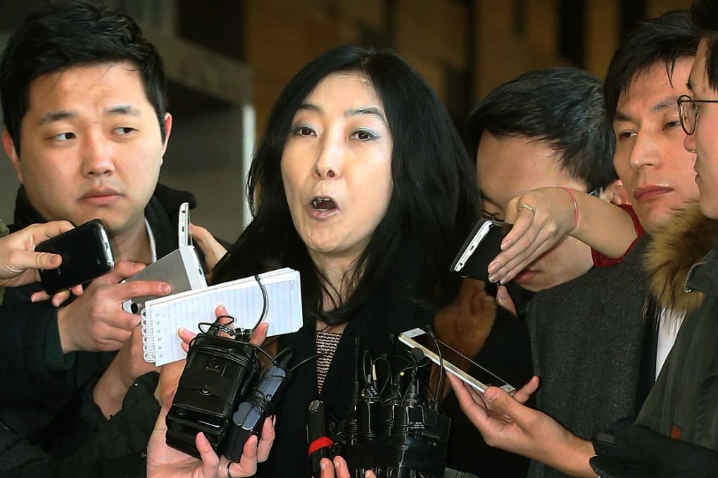 California-resident Shin Eun-mi (center) talks to the reporters at Seoul District Prosecutors' Office in Seoul, South Korea.  Photo: AP