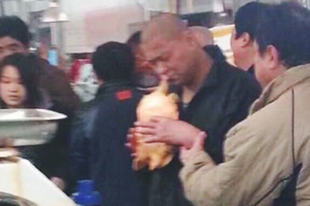 Turtle bites customer's face 'after he threatens to eat it live in Beijing food market'