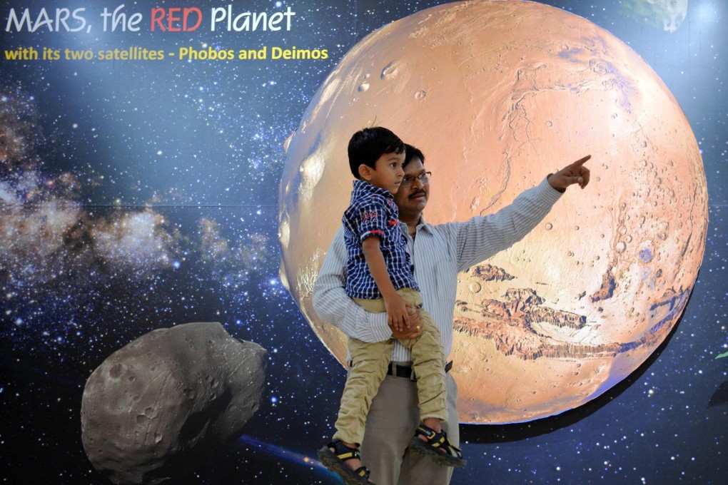Visitors at the Mars exhibit in a New Delhi planetarium. Photo: AFP
