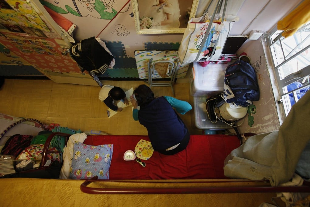 A mother and child in their Sham Shui Po flat. Photo: Reuters