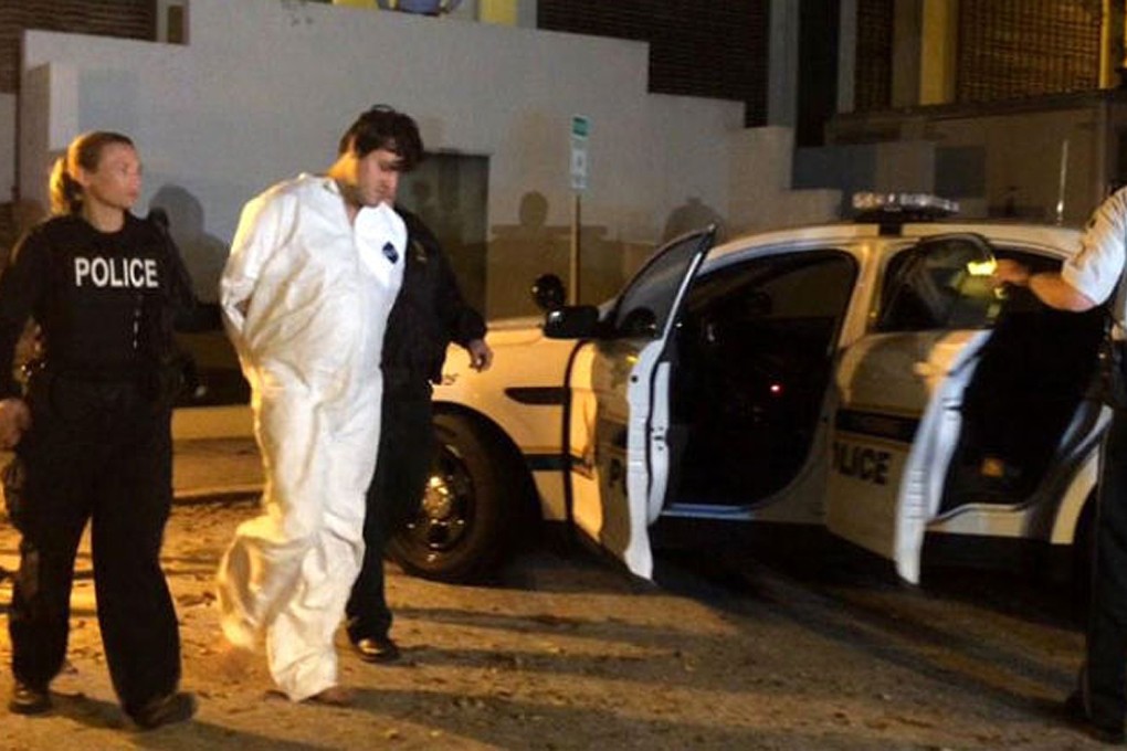 Police officers take John Jonchuck from police headquarters in St Petersburg, Florida to jail. Photo: AP