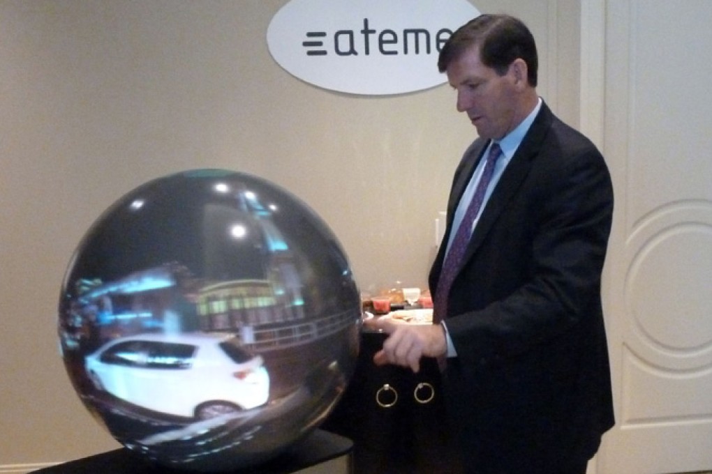 Ateme general manager Mike Antonovich demonstrates the LiveSphere 360-degree television system. Photo: AFP
