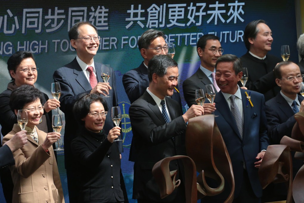 Leung Chun-ying (front row, third from left) and Simon Ip Sik-on (front row, second from right) yesterday. Photo: Felix Wong
