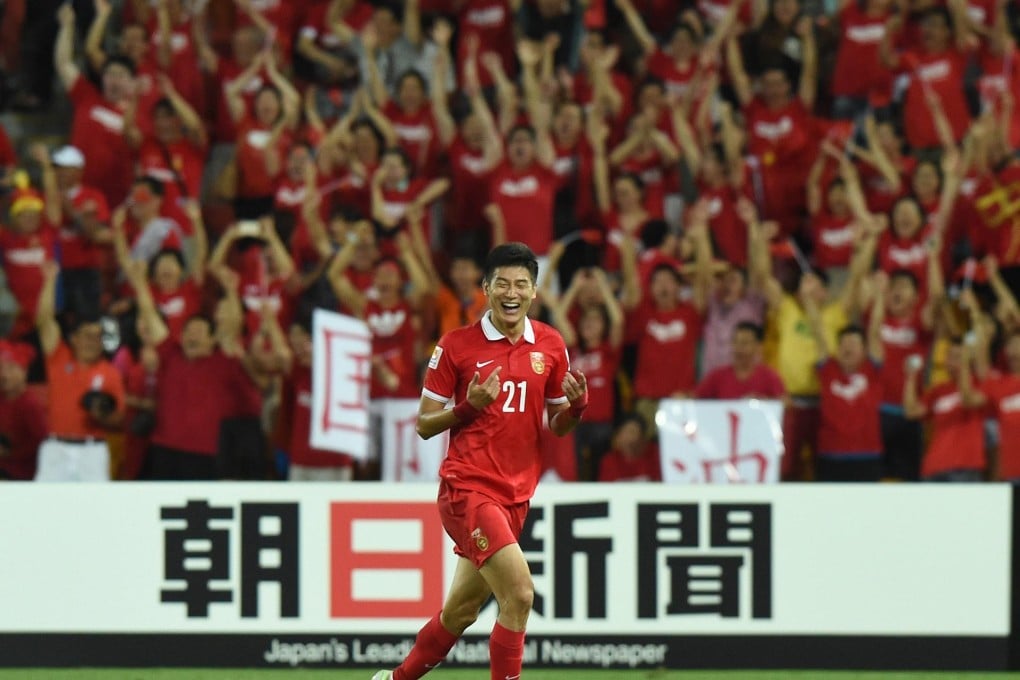 China's Yu Hai is elated after scoring the second-half winning goal in their group B Asian Cup match against three-time winners Saudi Arabia in Brisbane. China beat the Saudis 1-0. Photo: EPA