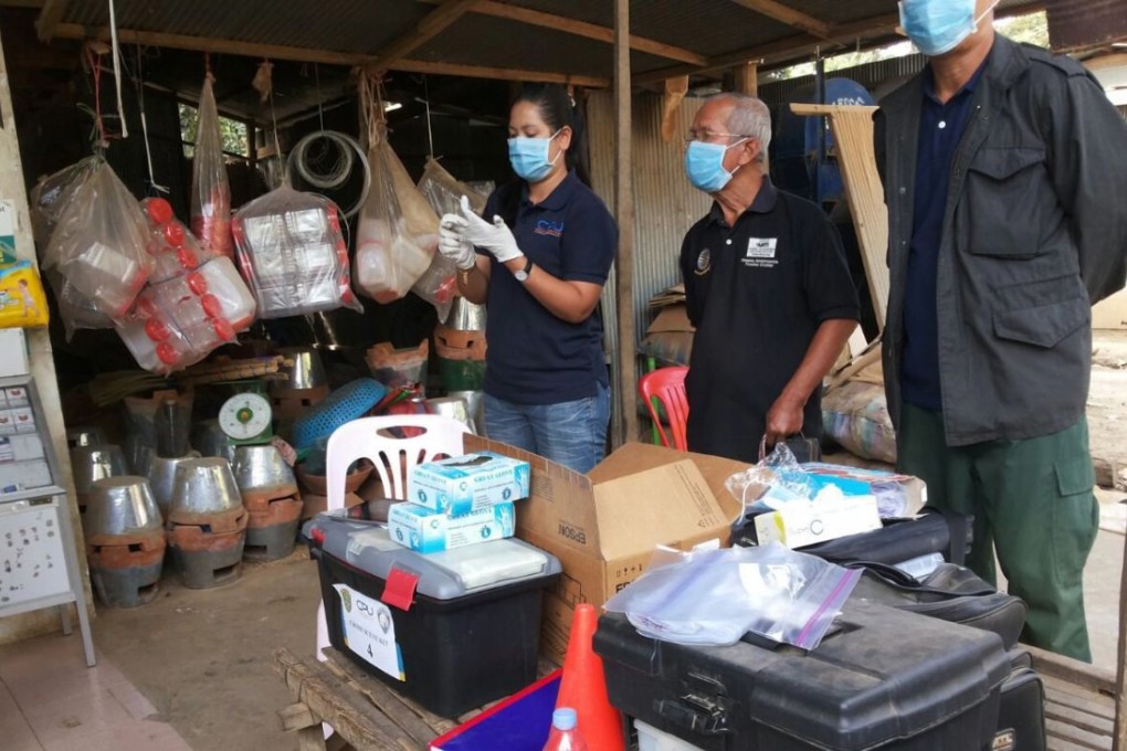 Cambodian officials prepare to inspect a nurse house in Roka commune in Battambang province, Cambodia. Photo: EPA