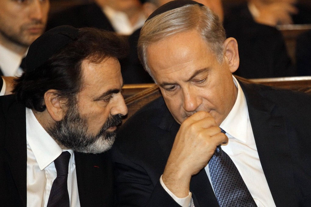 Benjamin Netanyahu (right) talks with French Jewish leader Joel Mergui.Photo: AFP