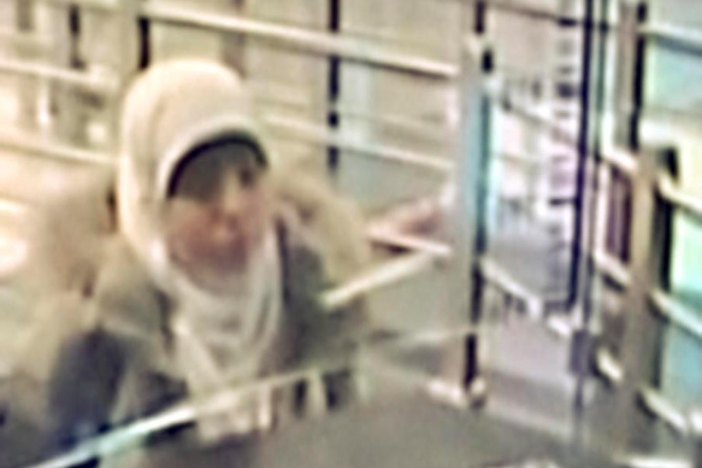 Hayat Boumeddiene caught on camera arriving at an airport in Istanbul. Photo: Reuters