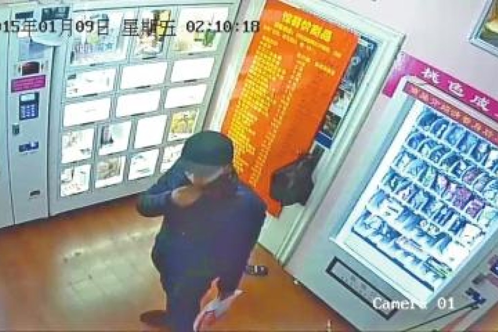 Police in Henan province said a man, filmed by a surveillance camera, is suspected of stealing cash and sex toys worth more than 10,000 yuan from eight Luoyang sex shops in one night. Photo: Dahe Daily