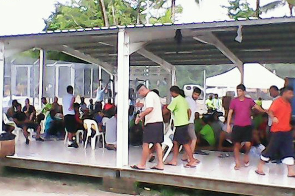 Asylum seekers are pictured inside the Manus Island detention centre in Papua New Guinea on January 13, 2015. Hundreds of asylum seekers have gone on hunger strike. Photo: Reuters