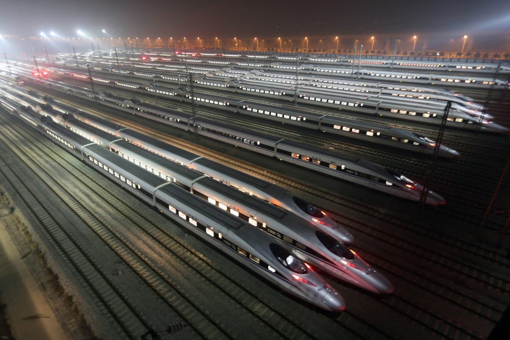 Chinese high speed trains sit in a maintenance base. The China CNR and CSR Corp, a pair of state enterprises set to merge, both denied allegations of insider trading. Photo: EPA