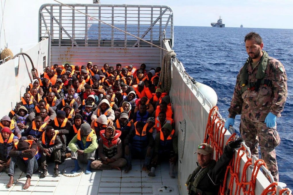 North African immigrants in an Italian Navy's amphibious vessel as they are rescued at sea off the coast of Libya. More than 276,000 irregular migrants entered the European Union last year. Photo: EPA