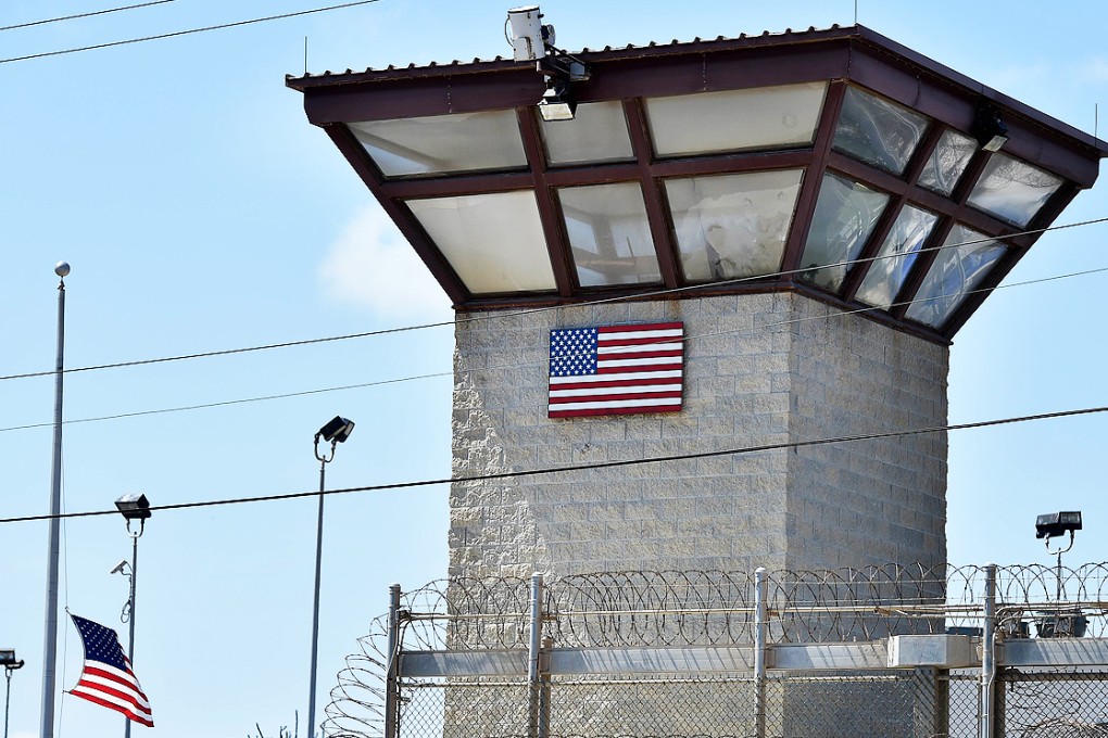 File picture reviewed by the US military shows the razor wire-topped fence and the watch tower of the detention facility at the US Naval Station in Cuba. Photo: AFP