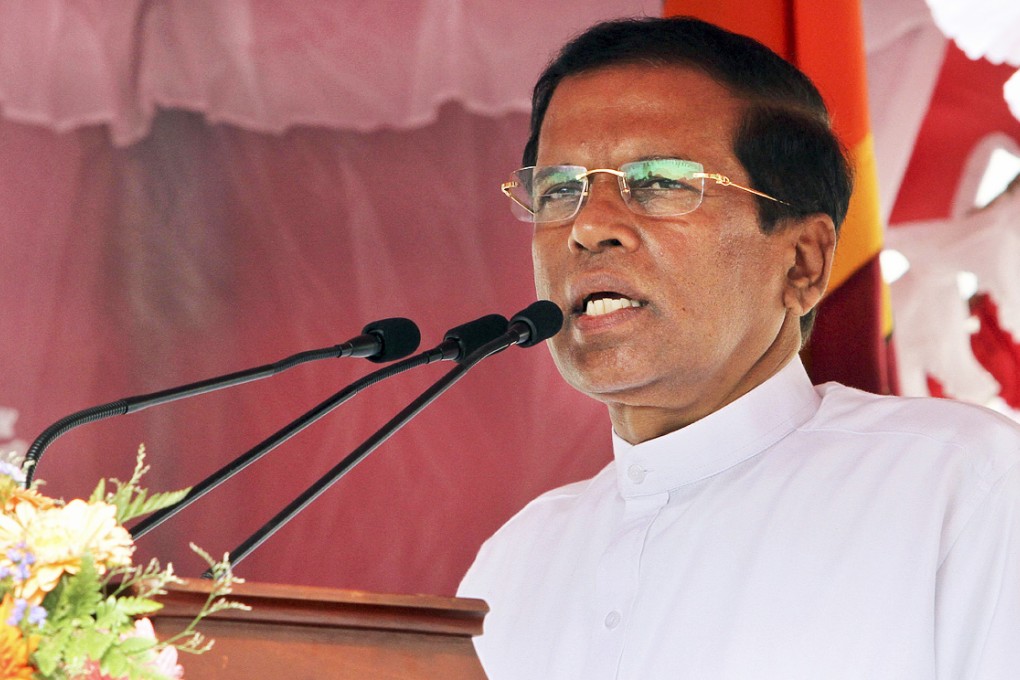 Sri Lanka’s new leader Maithripala Sirisena addresses the nation outside the Temple of Tooth in Kandy on Sunday. Photo: AP