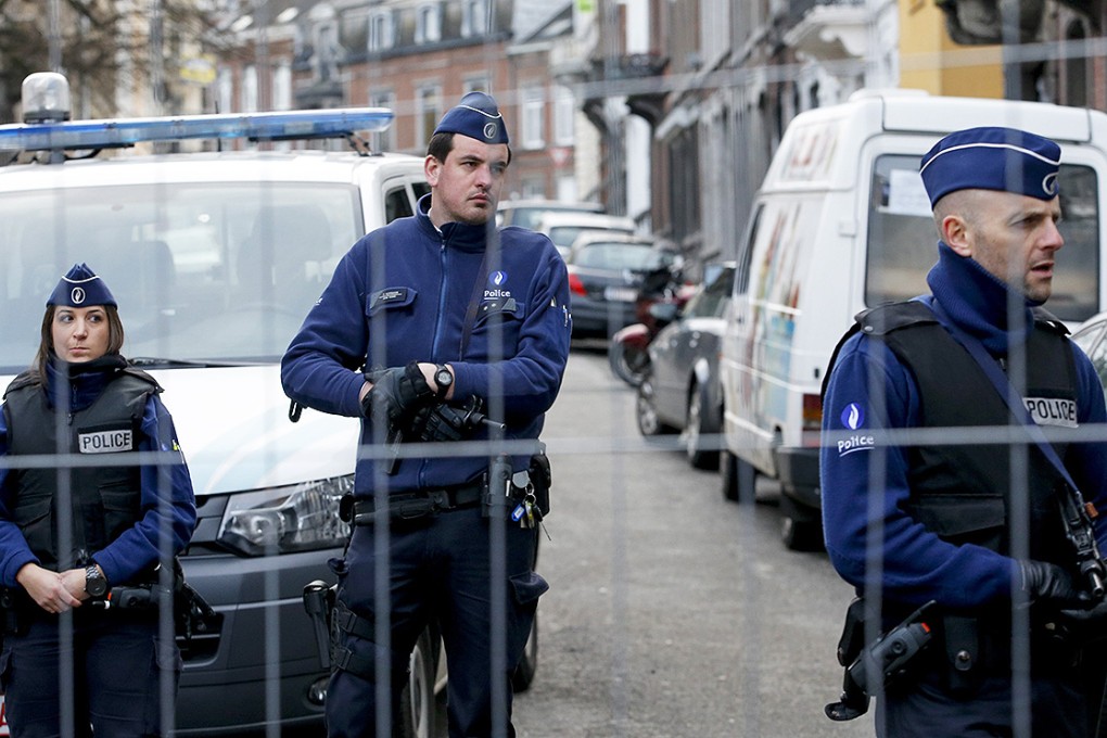 Police block the street of Colline in Verviers, eastern Belgium, where an anti terrorist operation took place. Photo: EPA