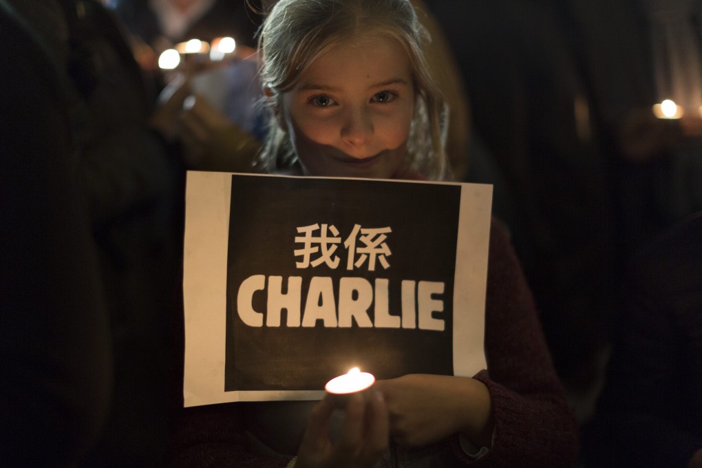 A show of solidarity for the victims of the Charlie Hebdo attack held in Hong Kong. The city enjoys a freer media than that which exists across the border. Photo: EPA