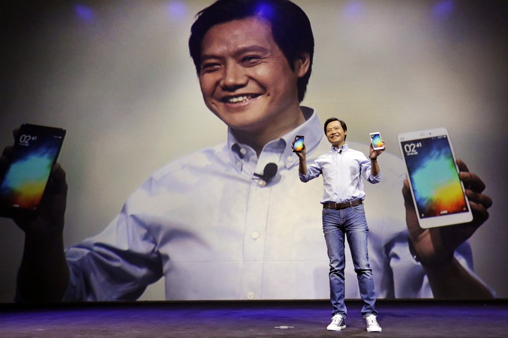 Xiaomi founder and chief executive Lei Jun shows off the company's latest handset at a launch event in Beijing. Photo: Reuters