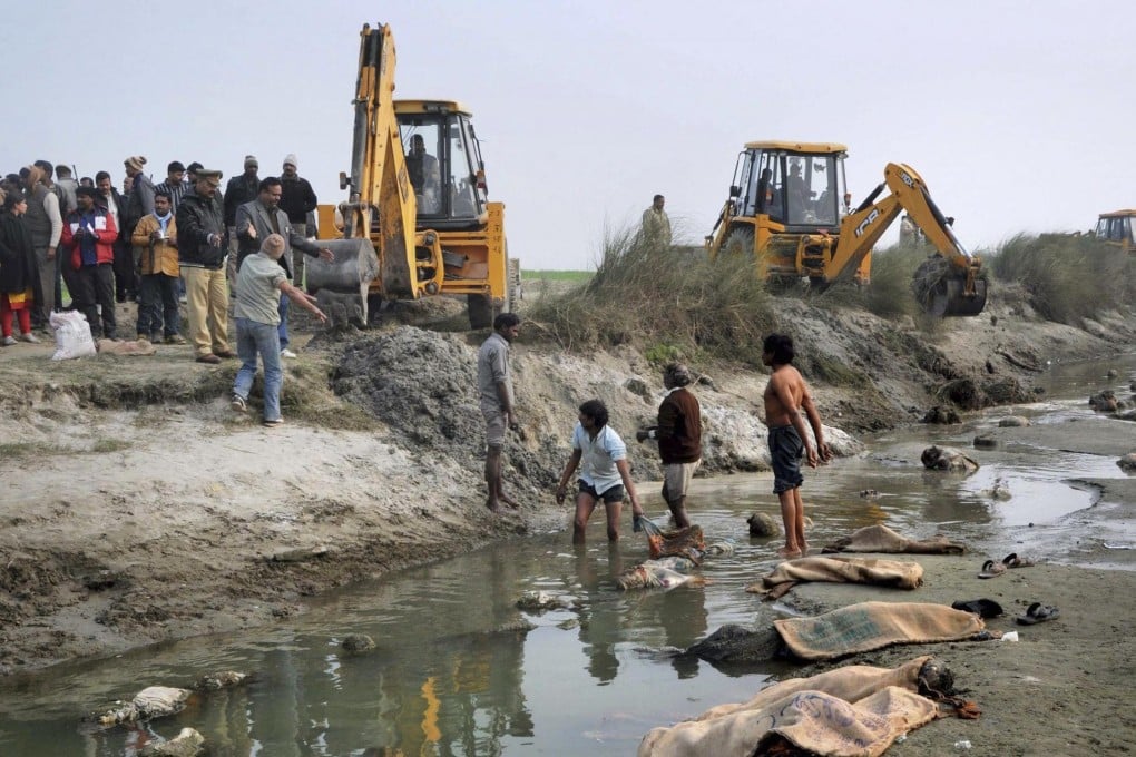 Workers pull dozens of corpses out of the River Ganges in India's most populous state of Uttar Pradesh last week. Photo: AP