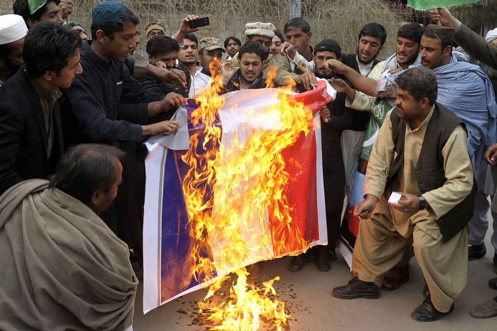 Pakistani demonstrators burn a French flag during a protest in Quetta. Photo: AFP