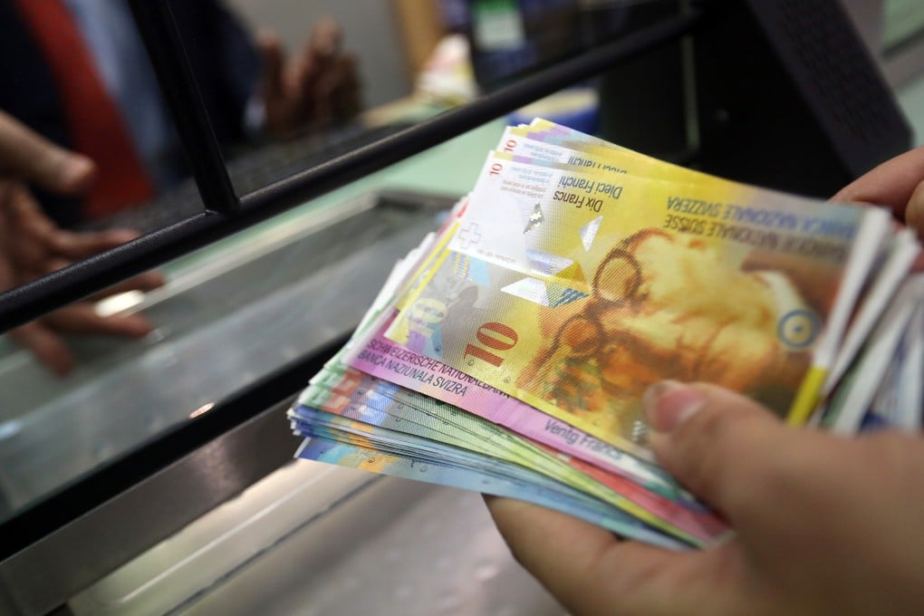 The Hong Kong Monetary Authority is looking into the foreign currency operations of banks and brokers amid the global fallout from a surging Swiss franc. Photo: Bloomberg