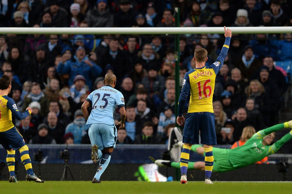 Manchester City keeper Joe Hart is beaten by a penalty from Arsenal's Santi Cazorla. Photo: EPA