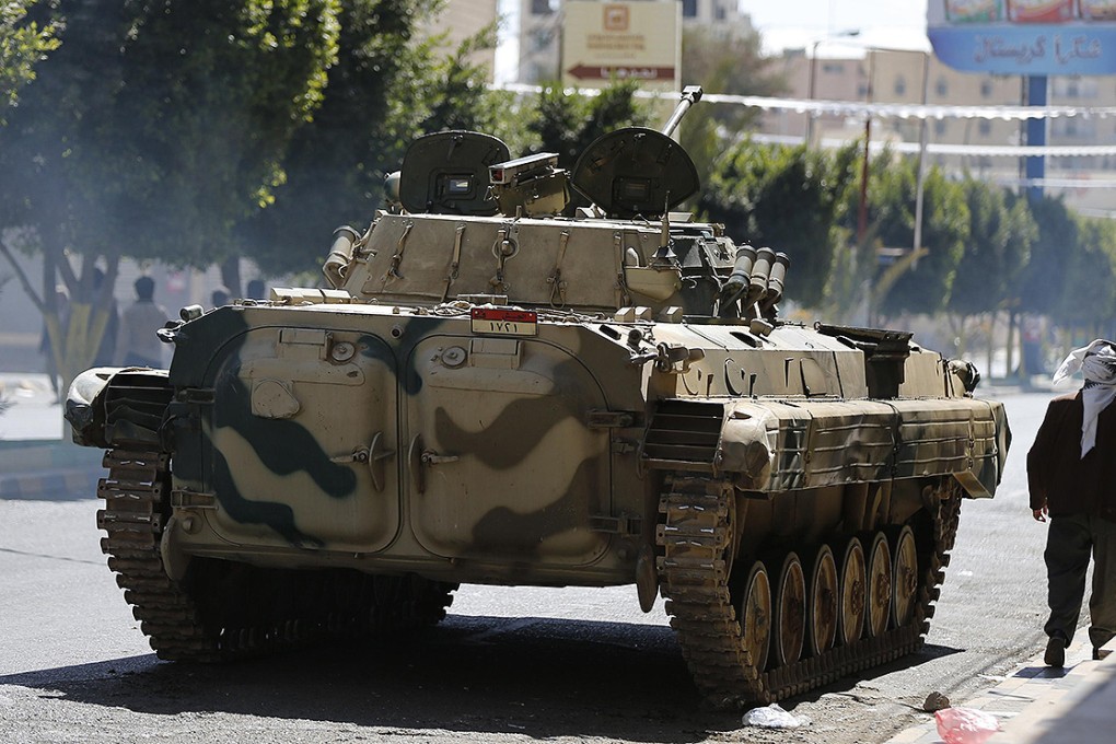 A military vehicle belonging to Houthi fighters is positioned on a street leading to the presidential palace during clashes in Sanaa. Photo: Reuters