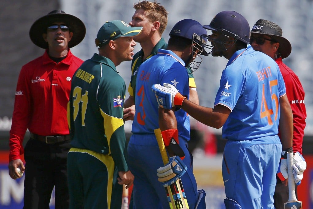 Australia's David Warner argues with India's Rohit Sharma during their one-day international at the Melbourne Cricket Ground. Photo: Reuters