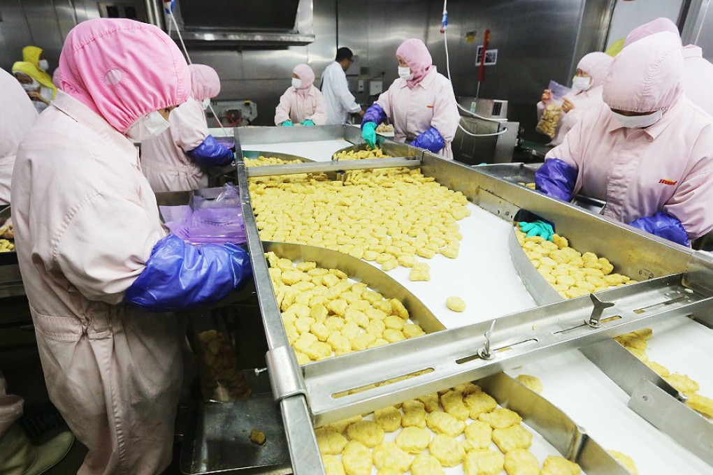 A production line at the Husi food factory before a raid uncovered meat products suspected of being beyond their expiration date. Photo: Reuters