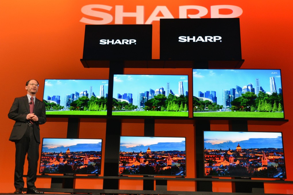 Sharp Corp of Japan unveils its new high-definition TV as the company in Tokyo issued a profit warning while its shares slid to a 2-year low. Photo: Kyodo
