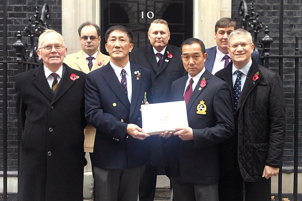 Roger Ching stands second left in the front row, with Andrew Rosindell on the right, as the campaign was taken to Downing Street in November. Photo: SCMP Pictures