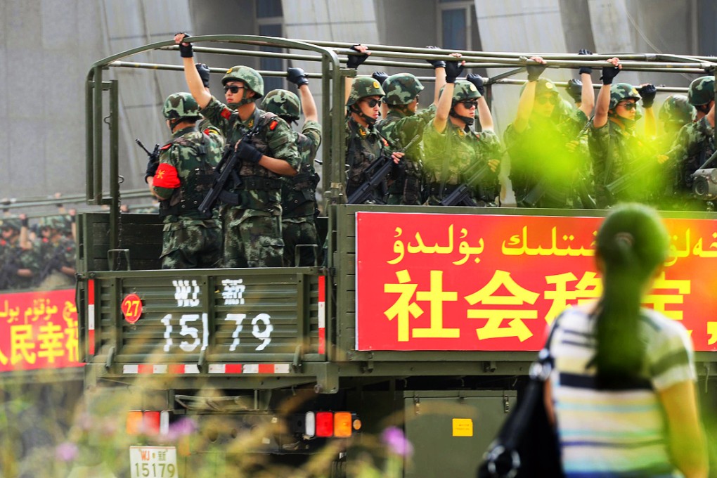 Security forces taking part in a drill in Hetian in Xinjiang last year. The government says tougher anti-terrorism laws are needed after a spate of violent attacks it blames on ethnic-Uygur militants from the region. Photo: AFP