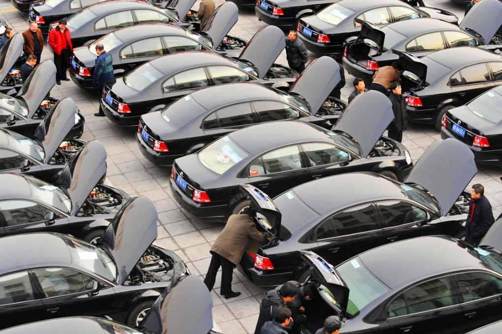 Drivers wait for dozens of delegates at the National People's Congress in government cars. Photo: AFP