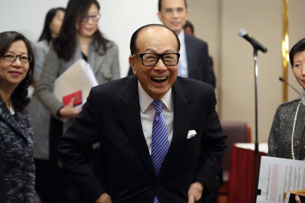 Asia's richest man Li Ka-shing laughs after a briefing in Hong Kong. The billionaire's Cheung Kong Infrastructure will issue new shares to raise HK$4.6 billion. Photo: Bloomberg