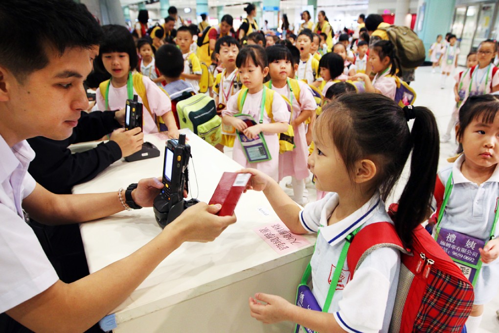 Officers of Immigration Department set up counters for cross-border students using portable ID checking device at Lok Ma Chau. Photo: Felix Wong
