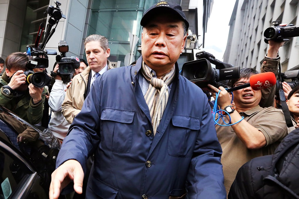 Media tycoon Jimmy Lai leaves police headquarters in Wan Chai yesterday morning after being arrested but not charged at a pre-scheduled meeting. Photo: Sam Tsang
