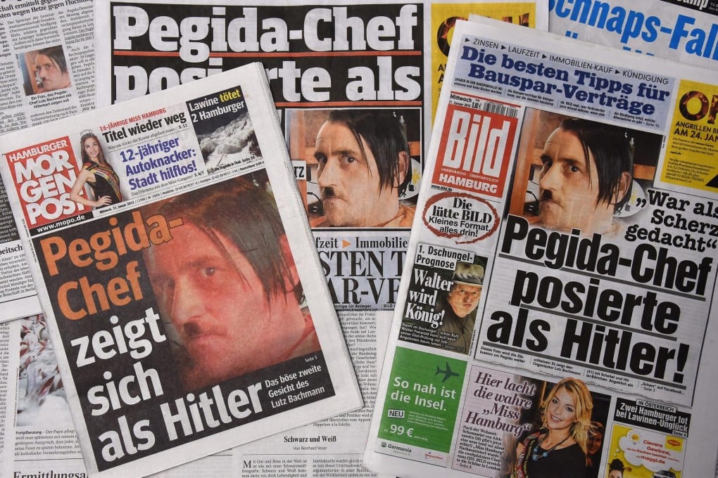 Newspapers show the picture of Lutz Bachmann posing as Adolf Hitler. Photo: EPA