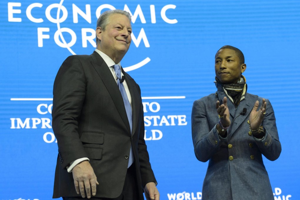 Al Gore (left) speaks next to US rapper Pharrell Williams. Photo: EPA