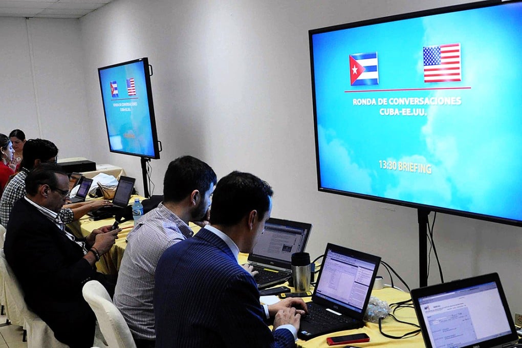 Journalists work at press room as delegates of the Unites States and Cuba meeting at the Palace of Convention in Havana. Photo: Xinhua