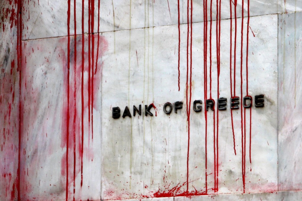 Bank of Greece hit with red paint. Photo: Reuters