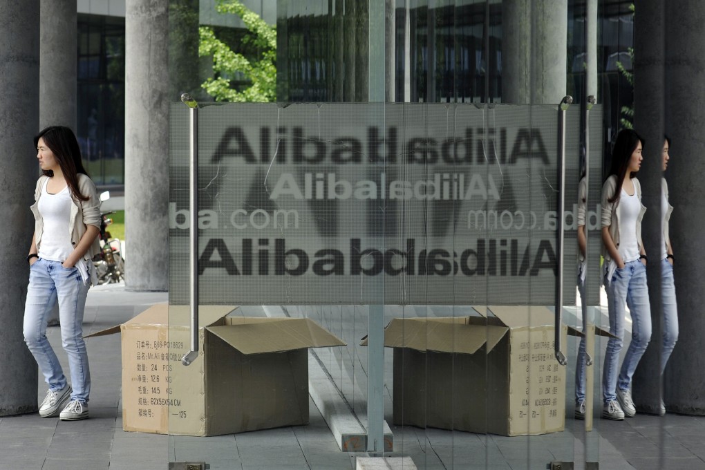 A woman walks out from the Alibaba head office building in Hangzhou, in eastern China's Zhejiang province on May 21, 2012. Photo: AFP