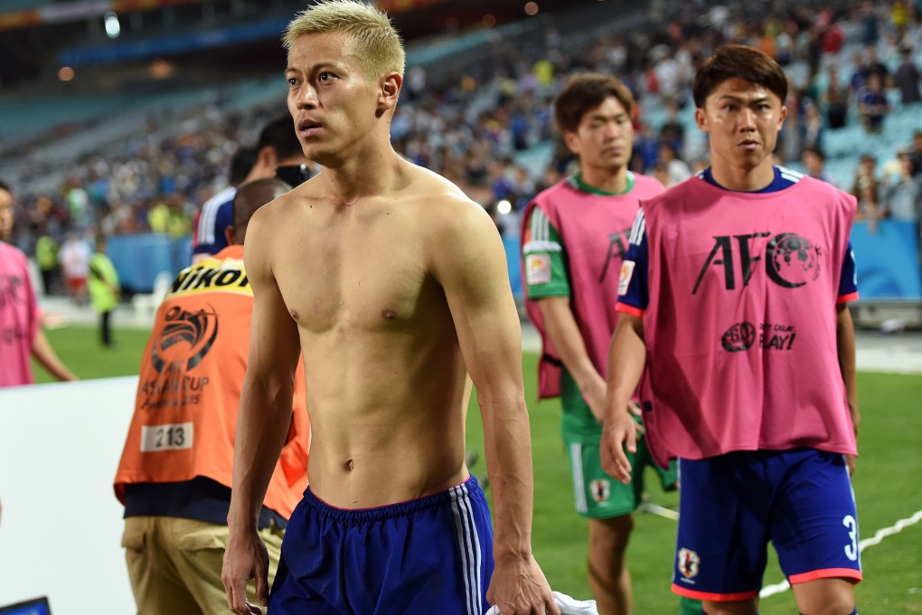 A dejected Keisuke Honda leaves the field following Japan's quarter-final penalty shootout defeat against United Arab Emirates. Photo: AFP