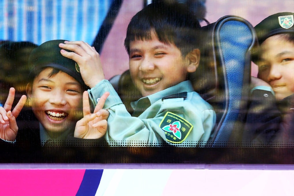 These young recruits signal their pleasure as they are driven to the inauguration ceremony at the PLA naval base on Stonecutters Island. Photo: Dickson Lee