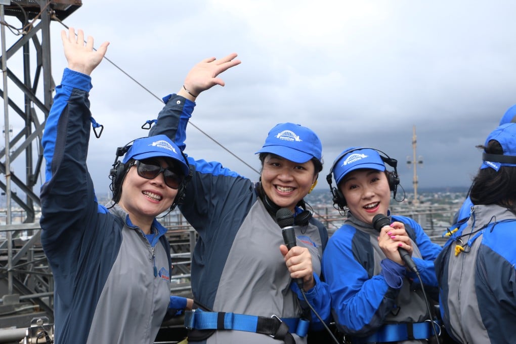 Putonghua-speaking climbers at the top of Sydney Harbour Bridge belt out their favourite Mandarin karaoke songs. Photo: SCMP