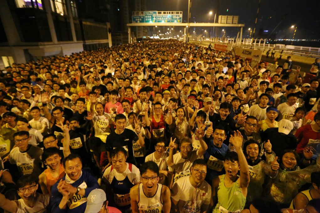 A swarm of competitors line up on the Island Eastern Corridor for the start of the hugely popular 10-kilometre events of the Hong Kong Marathon programme in the early hours of Sunday. Photo: Felix Wong