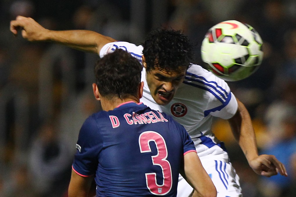 Eastern's Michel Lugo beats Kitchee's Daniel Cancela Rodriguez to a header during their clash at Mong Kok Stadium. Photos: Dickson Lee