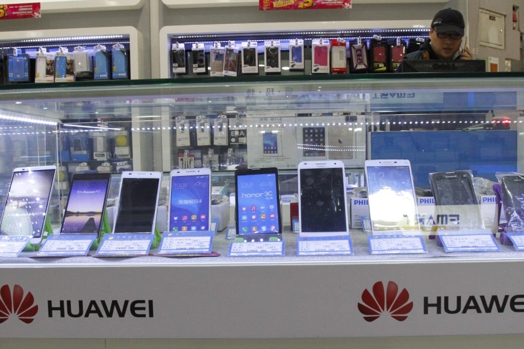 Huawei smartphone products are displayed for sale with other brands at a shopping mall in Beijing, China. Photo: EPA