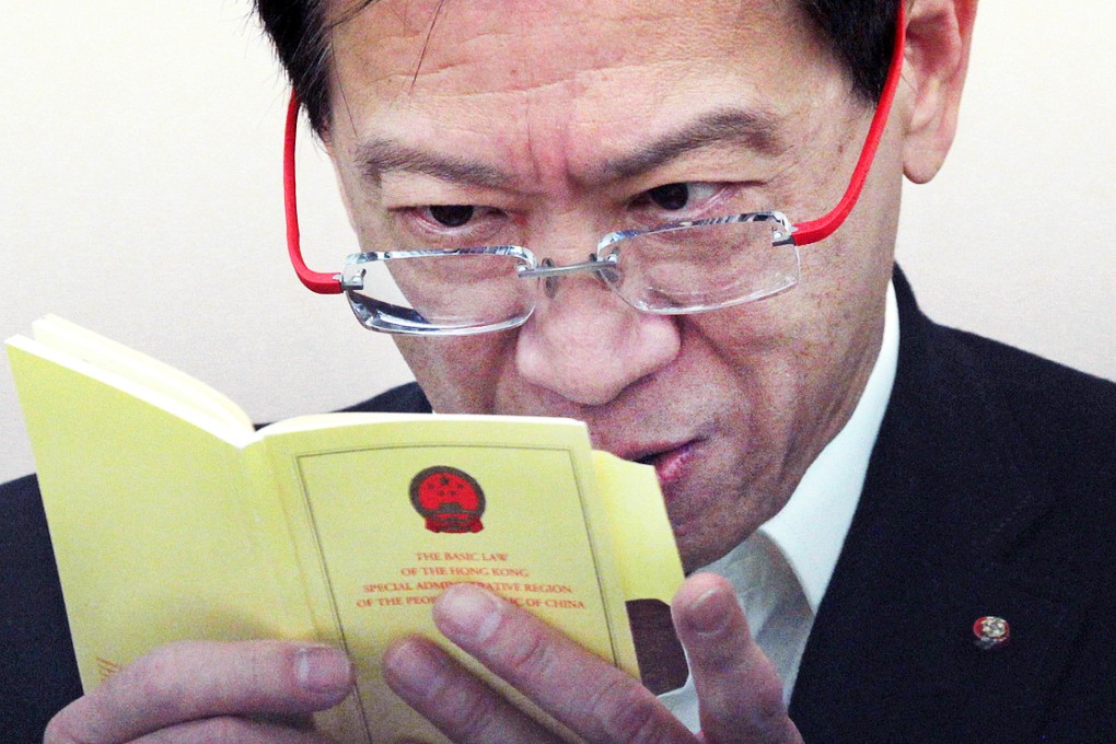 Basic Law Institute chairman Alan Hoo at a press conference on matters of political reform yesterday, while his love life was reportedly taking a new twist. Photo: Bruce Yan