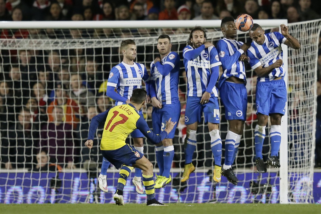 Arsenal's Alexis Sanchez takes a free kick against  Brighton  at the Amex Stadium in Brighton. Photo: AP