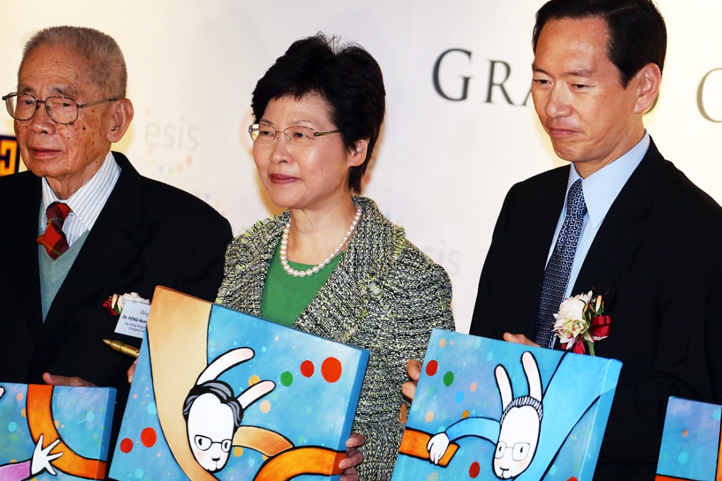 (From left) Henry Fong Yun-wah, chairman of Hip Shing Hong, Carrie Lam and Bernard Chan at the opening. Photo: Felix Wong