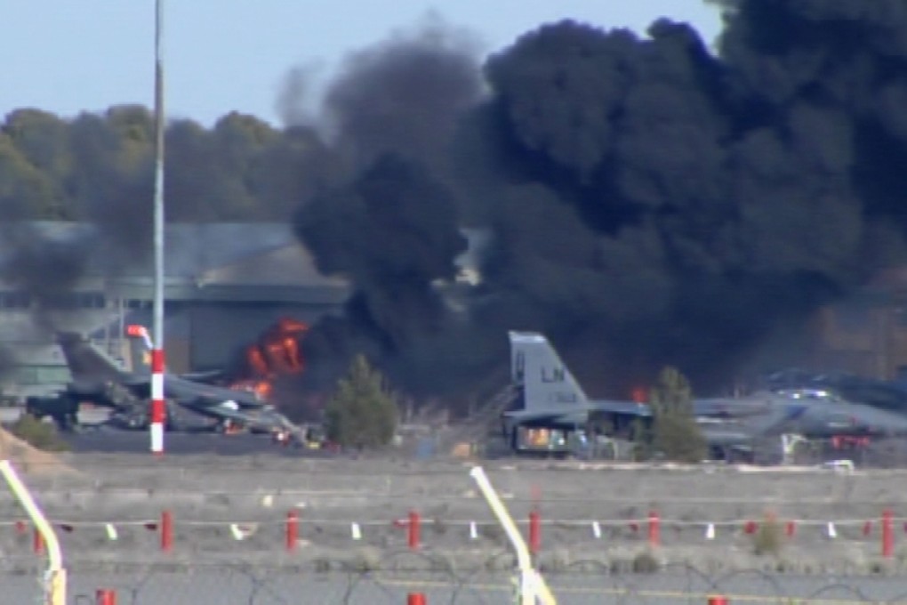 Smoke rises after a Greek F-16 jet fighter crashed during Nato training at Albacete air base in Spain on Monday. Photo: Reuters