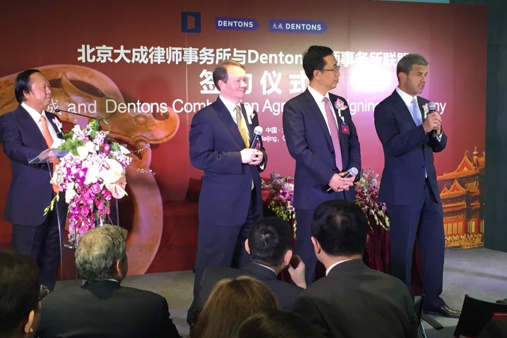 The signing ceremony in Beijing at the merger between Dacheng and Dentons to create the world's largest law firm. They include Dacheng senior partner Xiao Jinquan, Dentons global chairman Joseph Andrew, Dacheng chair and founding partner Peng Xuefeng, and Dentons global CEO Elliott Portnoy. Photo: Handout